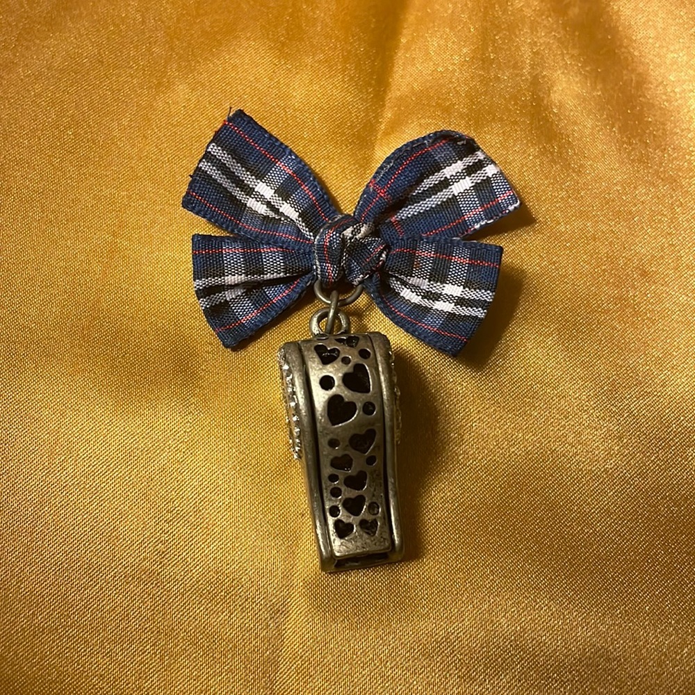 Metal whistle with hearts & rhinestones marked Aero w/fabric striped bow